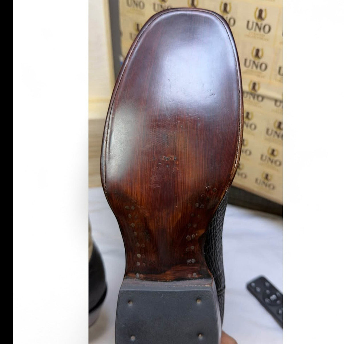 UNO Boots & Collectables western cowboy boot featuring a polished dark brown leather sole with square toe construction