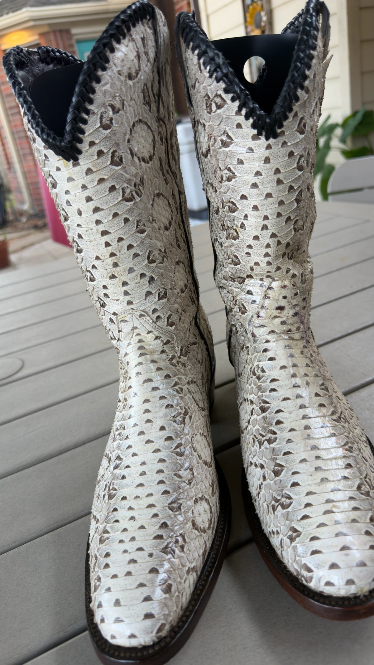 UNO Boots & Collectables genuine python skin cowboy boots in cream and earth tones with dark braided collar trim.