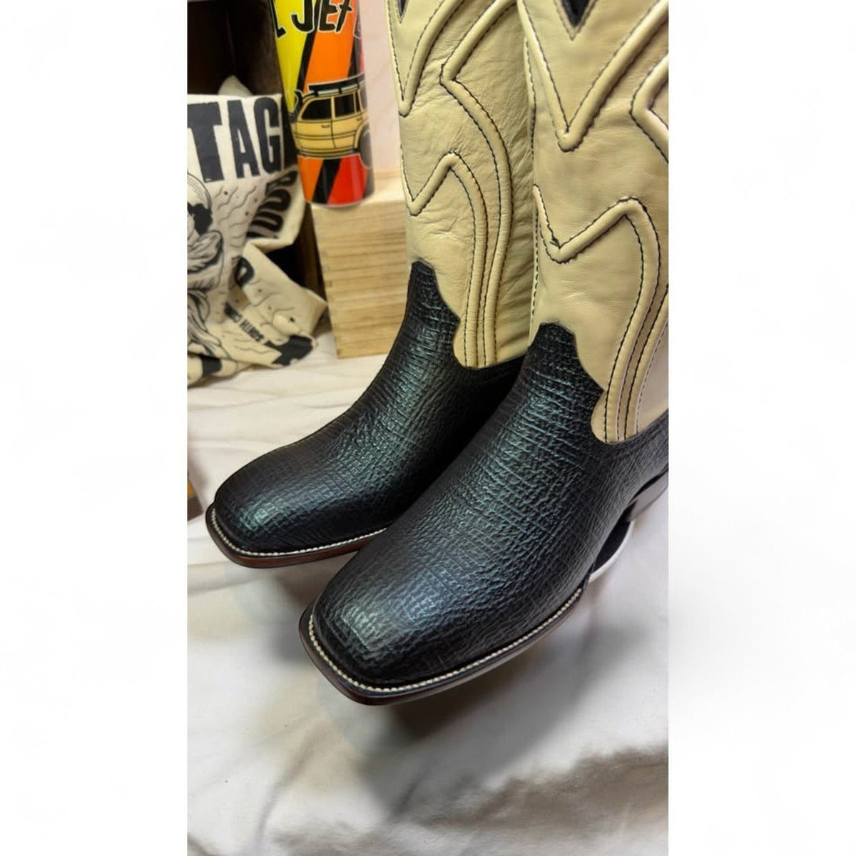 UNO Boots & Collectables western cowboy boots with black textured leather vamps and cream shafts with square toes.