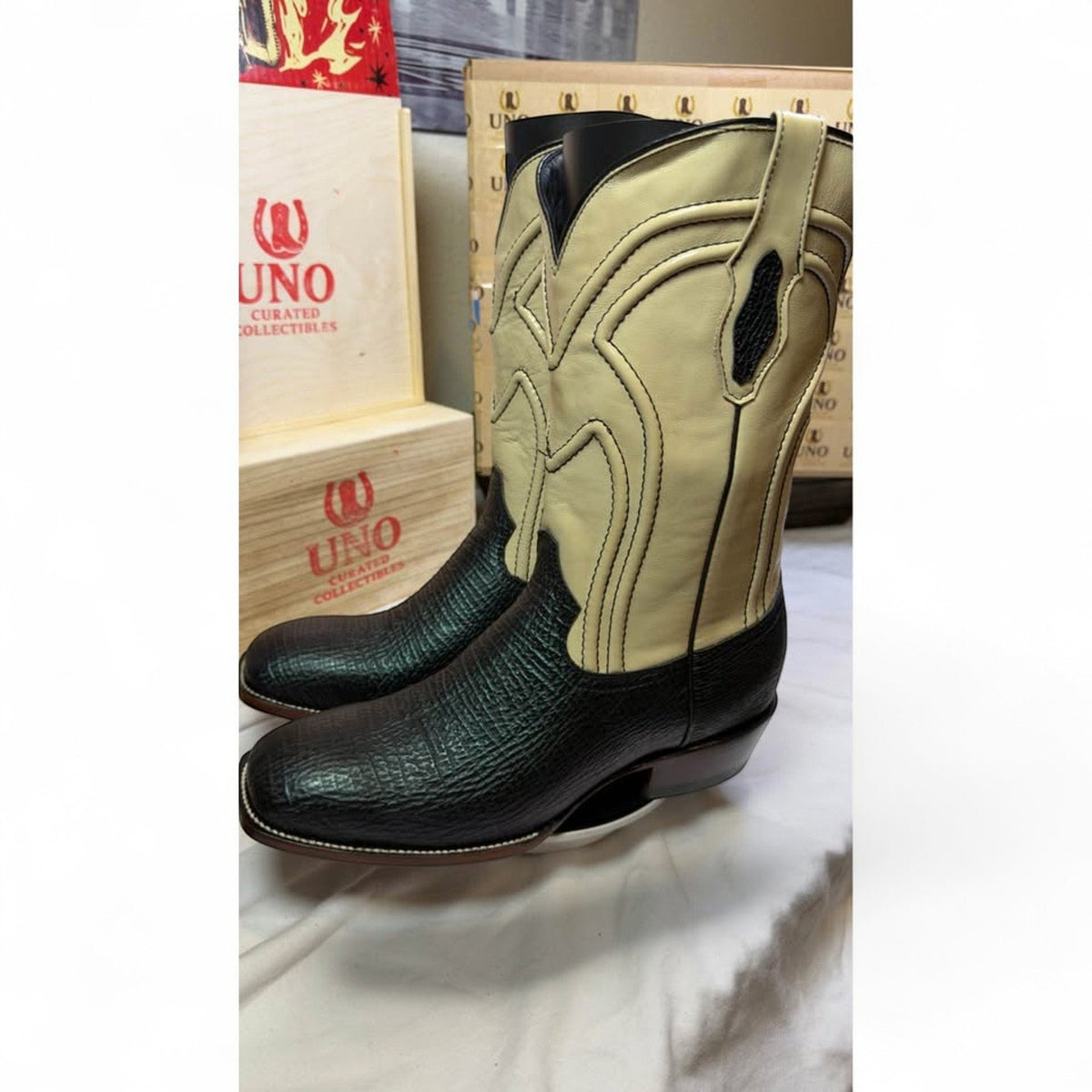 UNO Boots & Collectables two-tone cowboy boots with black textured vamp and cream leather shaft, square toe design.